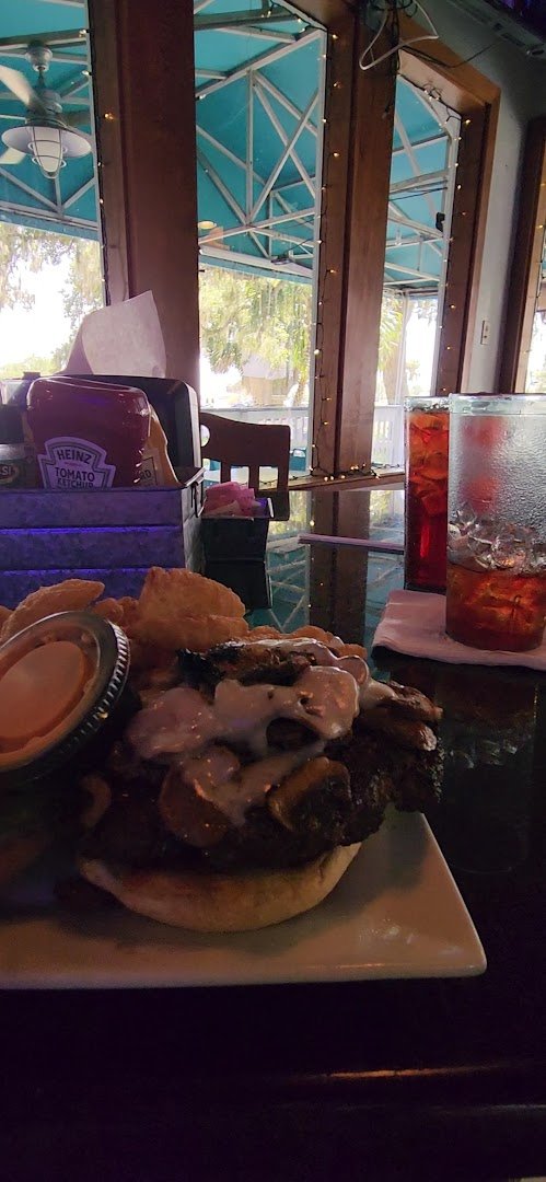 Patio seating beside an American restaurant